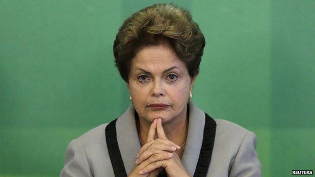 Brazil"s President Dilma Rousseff reacts to press questions on corruption scandal and demos during the signing ceremony of the Civil Procedure Code at the Planalto Palace in Brasilia