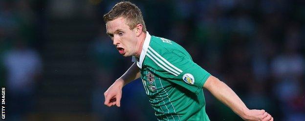 Shane Ferguson in action for Northern Ireland