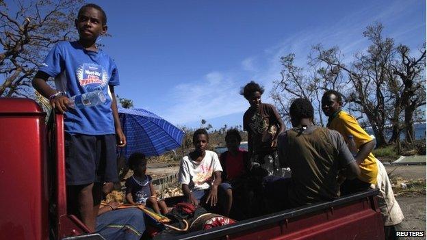 Children ride on a truck in Lenakel town after Cyclone Pam struck in Tanna, about 200km from Port Vila, capital of Vanuatu March 17, 2015