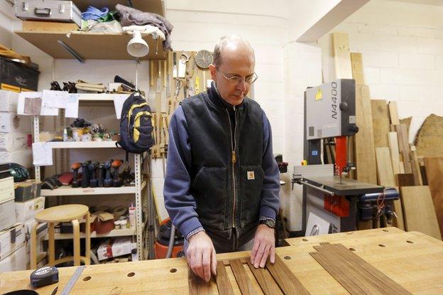 Canadian-born furniture maker Michael Ibsen works in his furniture workshop in London in 2012