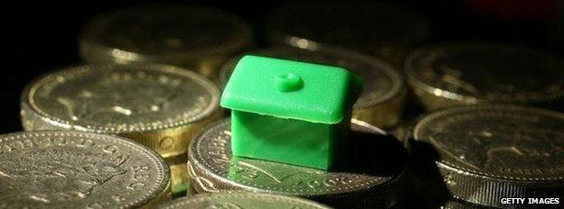 Monopoly piece on house