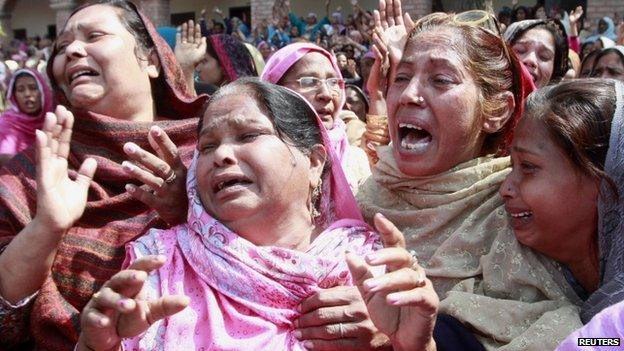 Women from the Christian community mourn for their relatives, who were killed by a suicide attack on a church, during their funeral in Lahore, March 17, 2015