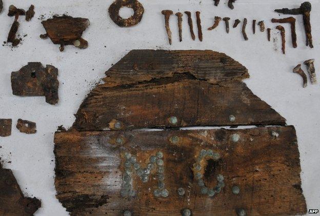 The initials "M.C" are seen on a plank of a coffin found on unidentified graves in the chapel’s crypt of the closed order Convent of the Barefoot Trinitarians in Madrid's historic Barrio de las Letras, or Literary Quarter.