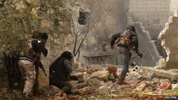 Rebel fighters in a village north of Aleppo in Syria