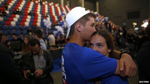 Zionist Union party supporters react after hearing exit poll results in Tel Aviv, 17 March 2015