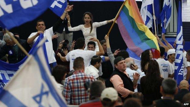 Supporters of Israeli Prime Minister Benjamin Netanyahu's Likud party react to exit poll figures as they wait for the announcement of the first official results of Israel's parliamentary elections on March 17, 2015