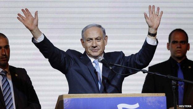 Israeli PM Benjamin Netanyahu (centre) waves to his supporters in Tel Aviv