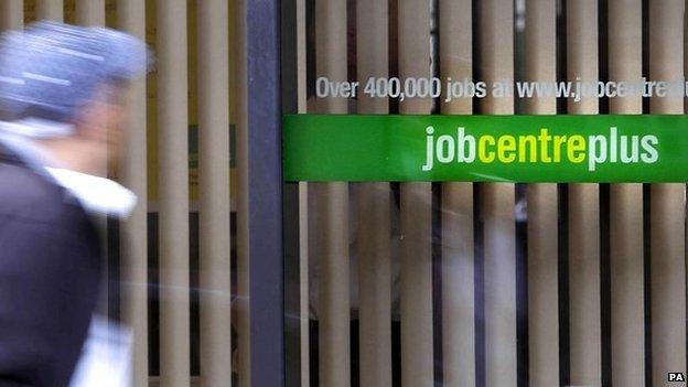 A man walks past a job centre