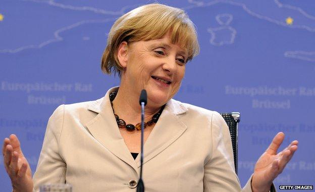 Angela Merkel smiling at a press conference in June 2013