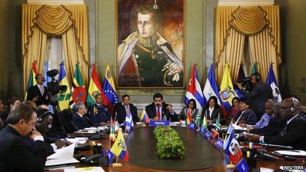 Venezuela's President Nicolas Maduro (centre) and Alba representatives speak during an Alba alliance summit in Caracas on 17 March, 2015.