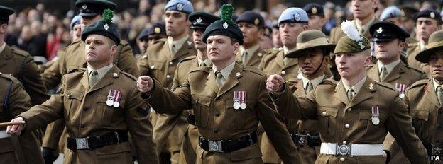 Members of Army regiments march from St Paul"s Cathedral following a commemoration service to mark the end of combat operations in Afghanistan