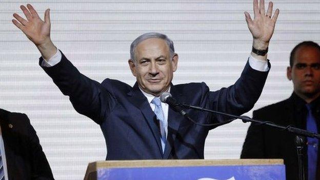 Israeli Prime Minister Benjamin Netanyahu waves to supporters at the party headquarters in Tel Aviv March 18, 2015