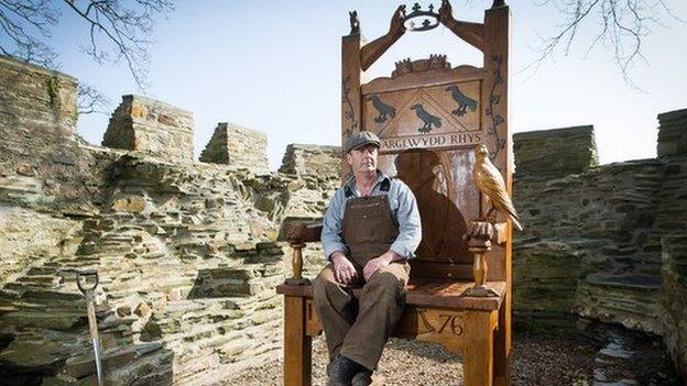 Sculptor Paul Clarke with his 9ft Eisteddfod chair