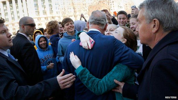 Prince hugged by a well-wisher