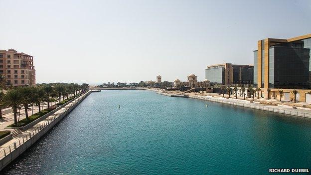 View of a canal surrounded by buildings