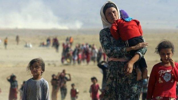 Displaced people from the minority Yazidi sect, fleeing violence from forces loyal to the Islamic State in Sinjar town - August 11, 2014