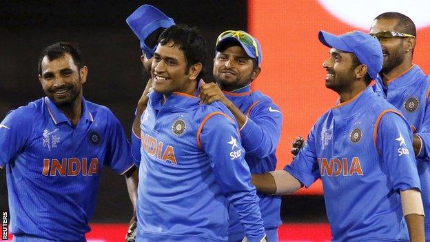 MS Dhoni (second from left) and Indian players celebrate during the quarter-final with Bangladesh