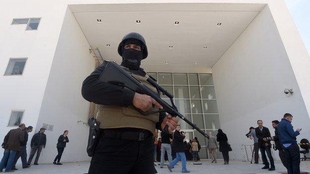 Tunisian security forces stand guard outside the National Bardo Museum in Tunis. 19 March 2015