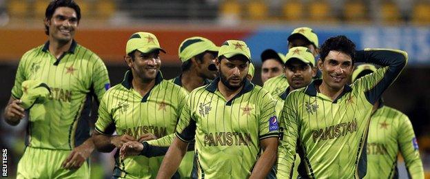 Pakistan players, including Misbah-ul-Haq (right)