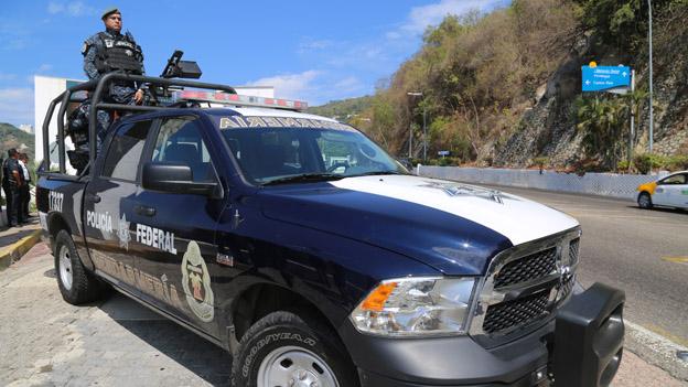 Federal police officers on patrol in Acapulco in March 2015