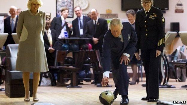 Prince Charles throwing a bowling ball