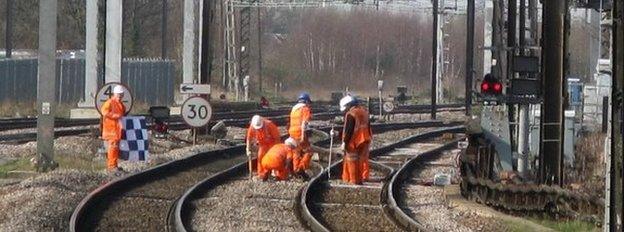 Workmen on a rail line