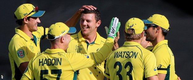 Josh Hazlewood (centre) celebrates with team-mates