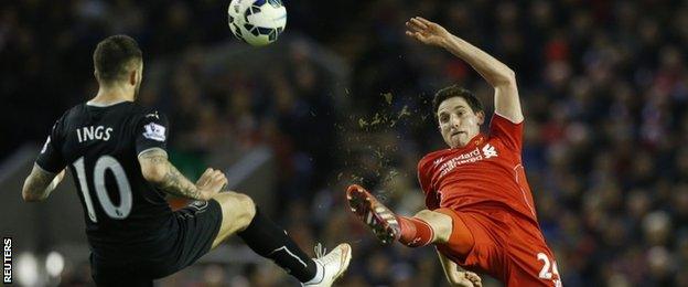 Liverpool midfielder Joe Allen challenges Burnley striker Danny Ings