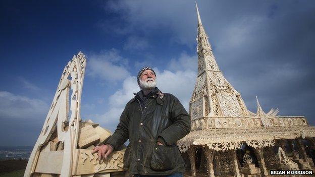 Artist David Best next to the finished temple structure