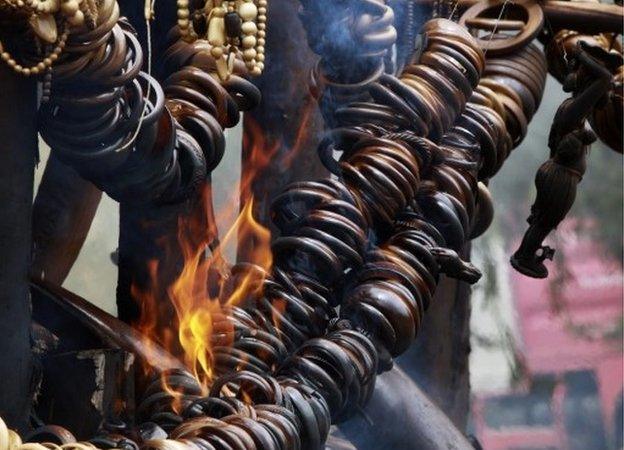 Jewellery and artefacts made of ivory are burnt outside of Addis Ababa