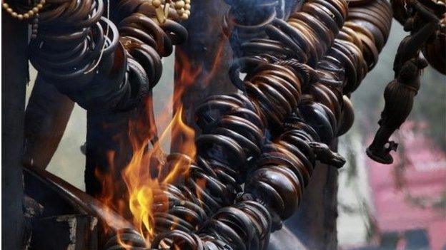 Jewellery and artefacts made of ivory are burnt outside of Addis Ababa