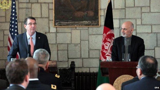 A handout photo provided by the Afghanistan Presidential Office on 21 February 2015 of new US Secretary of Defense Ashton Carter (L) and Afghanistan"s president Ashraf Ghani (R) talking with journalists during a joint press conference in Kabul, Afghanistan, 21 February 2015.