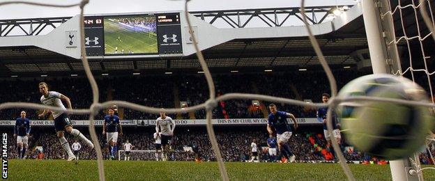 Tottenham striker Harry Kane scores a penalty against Leicester