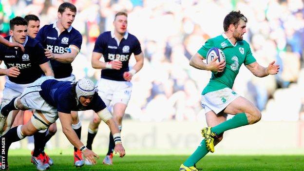 Ireland centre Jared Payne races through to score against Scotland.