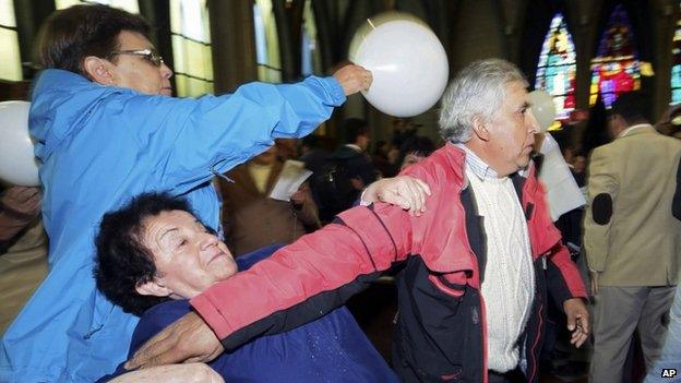 Supporters of Bishop Barros tried to stop the protest