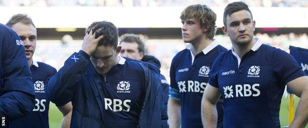 Scotland's players their disappointment at full-time