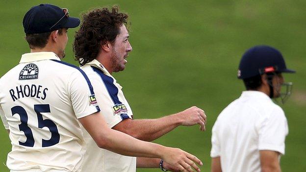 Ryan Sidebottom celebrates as Alastair Cook departs