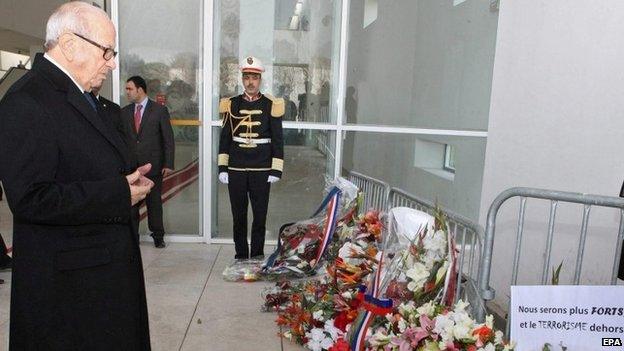 Tunisian President Beji Caid Essebsi lays a wreath in memory of those killed at the Bardo museum attack, 22 March 2014