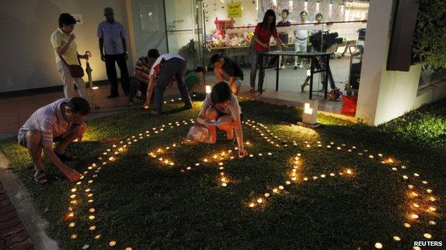 Residents light candles to spell out LKY at a community club in Tanjong Pagar on 22 March 2015