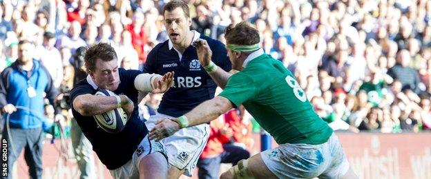 Stuart Hogg is tackled by Jamie Heaslip at Murrayfield