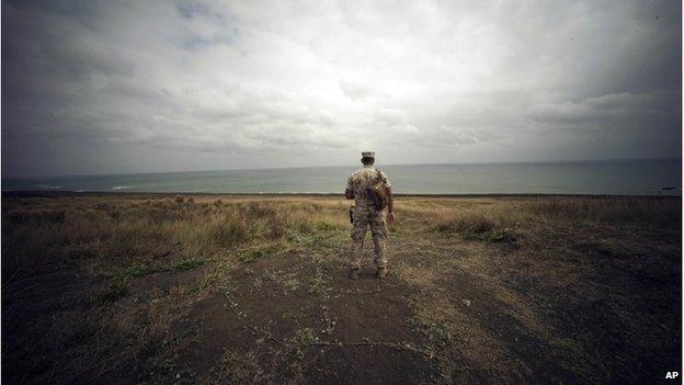 A US Marine looks over Invasion Beach on Iwo Jima (21 March 2015)