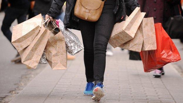 Shopper carrying shopping bags