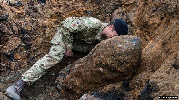 Army engineer working on the bomb