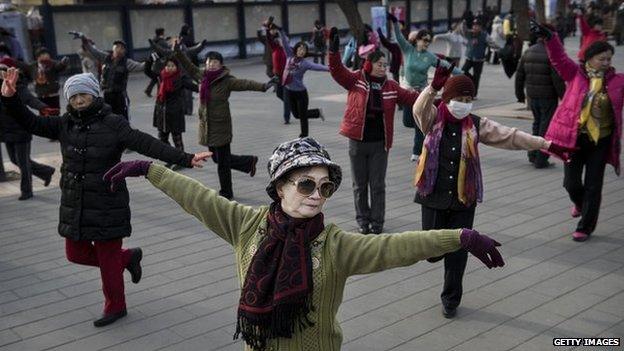 Chinese women dancing in a park