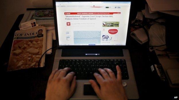 An Indian man surfs the internet inside an internet cafe in New Delhi, India, Tuesday, March 24, 2015