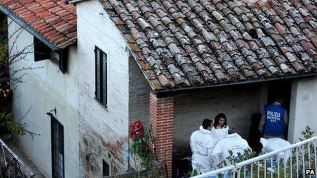 Police search the house where the murder occurred in Perugia, Italy, 3 November 2011