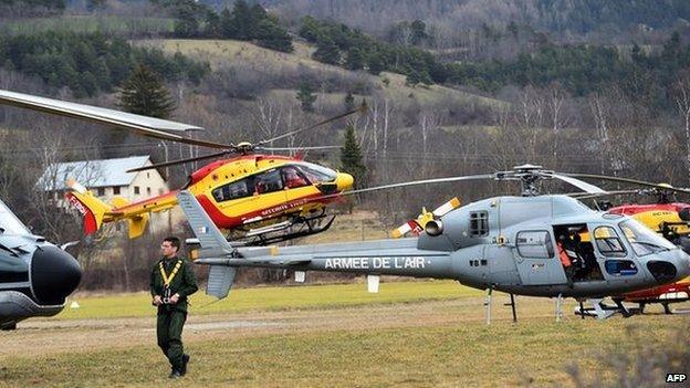 Helicopters of the French Air Force (back) and civil security services are seen in Seyne, south-eastern France, on 24 March 2015