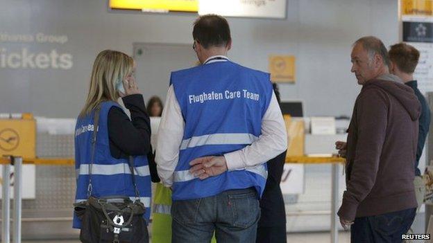 Members of the airport care team gather at Duesseldorf airport 24 March 2015