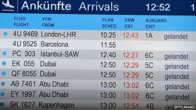 An arrivals board shows the missing Germanwings flight 4U9525 from Barcelona to Duesseldorf at Duesseldorf International Airport on Tuesday