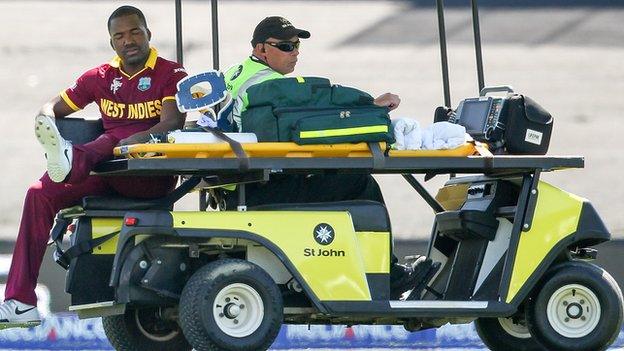 Darren Bravo leaves the field on an injury cart